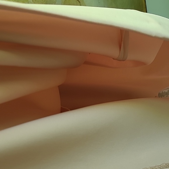 Dusty rose poly spandex  creates a lovely designer dress. I wish it fit me! - Picture 7 of 12